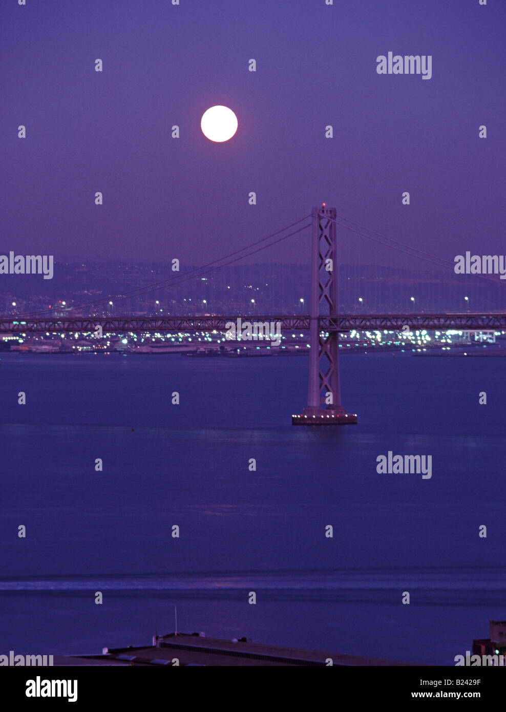 Moon over San Francisco Oakland Bay Bridge California Stock Photo