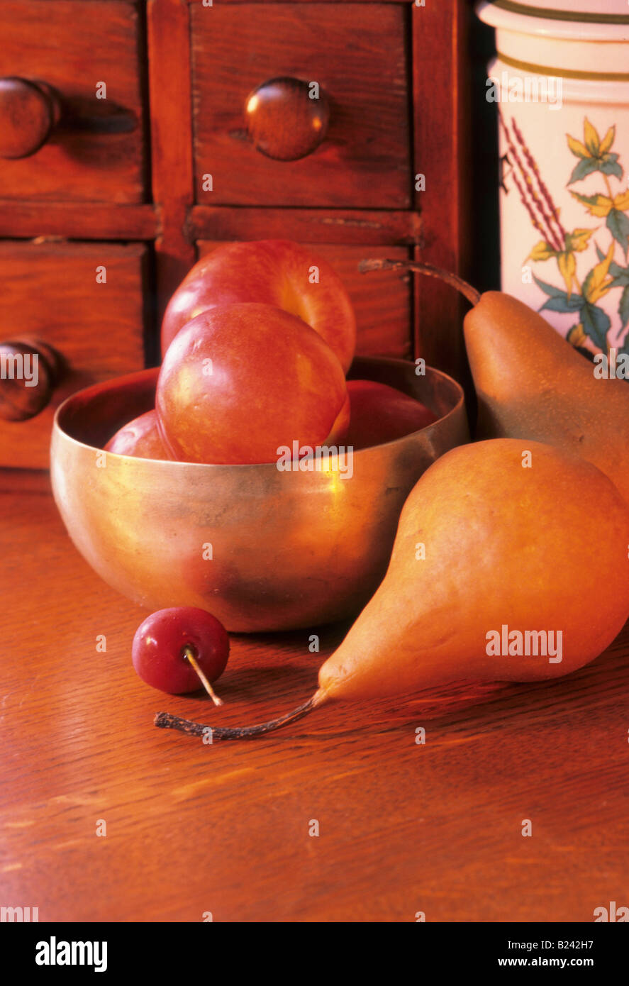 NECTARINES CHERRY PEARS SPICE RACK IN BACKGROUND Stock Photo