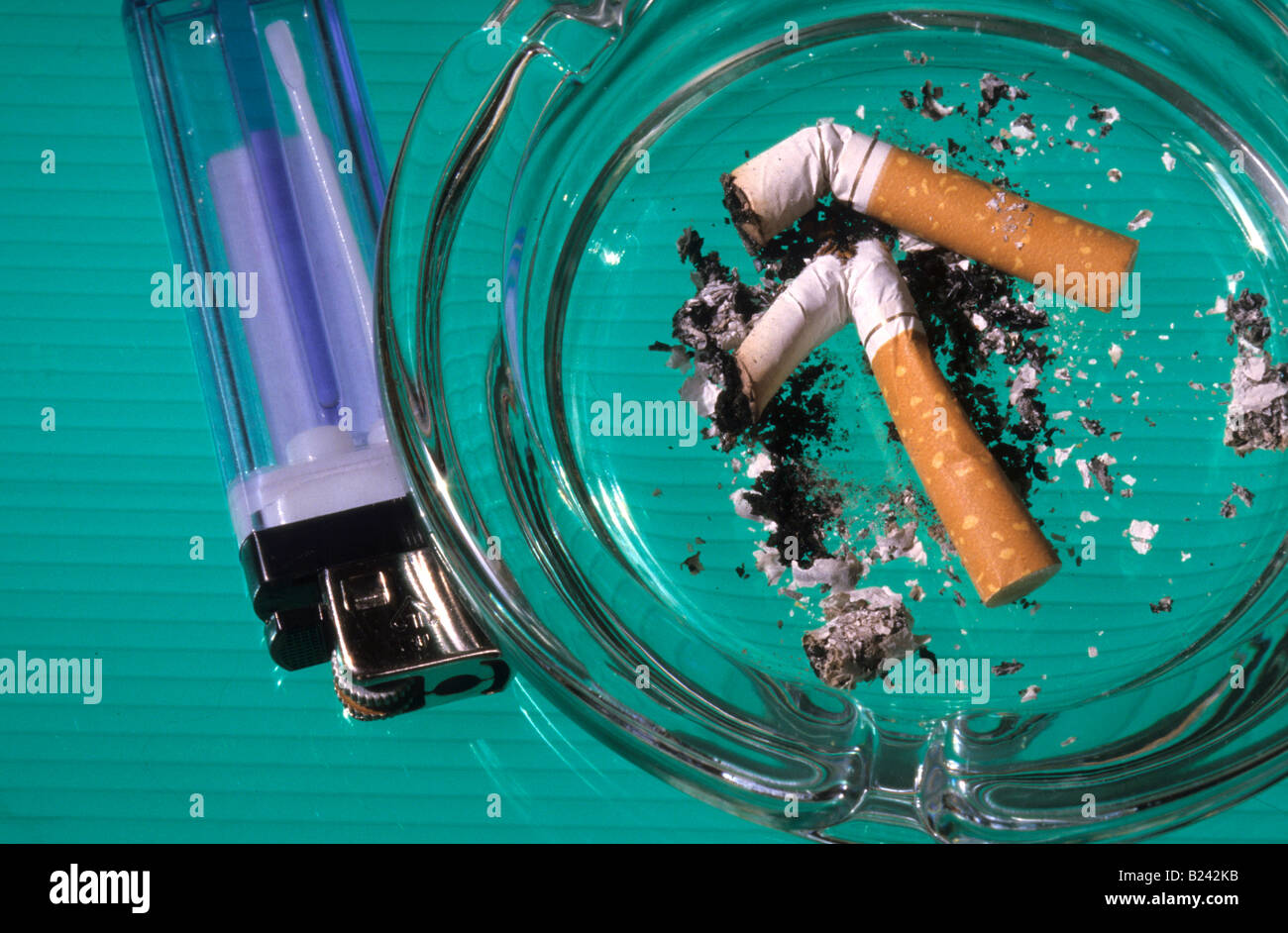 Disposable lighter and ashtray Stock Photo Alamy