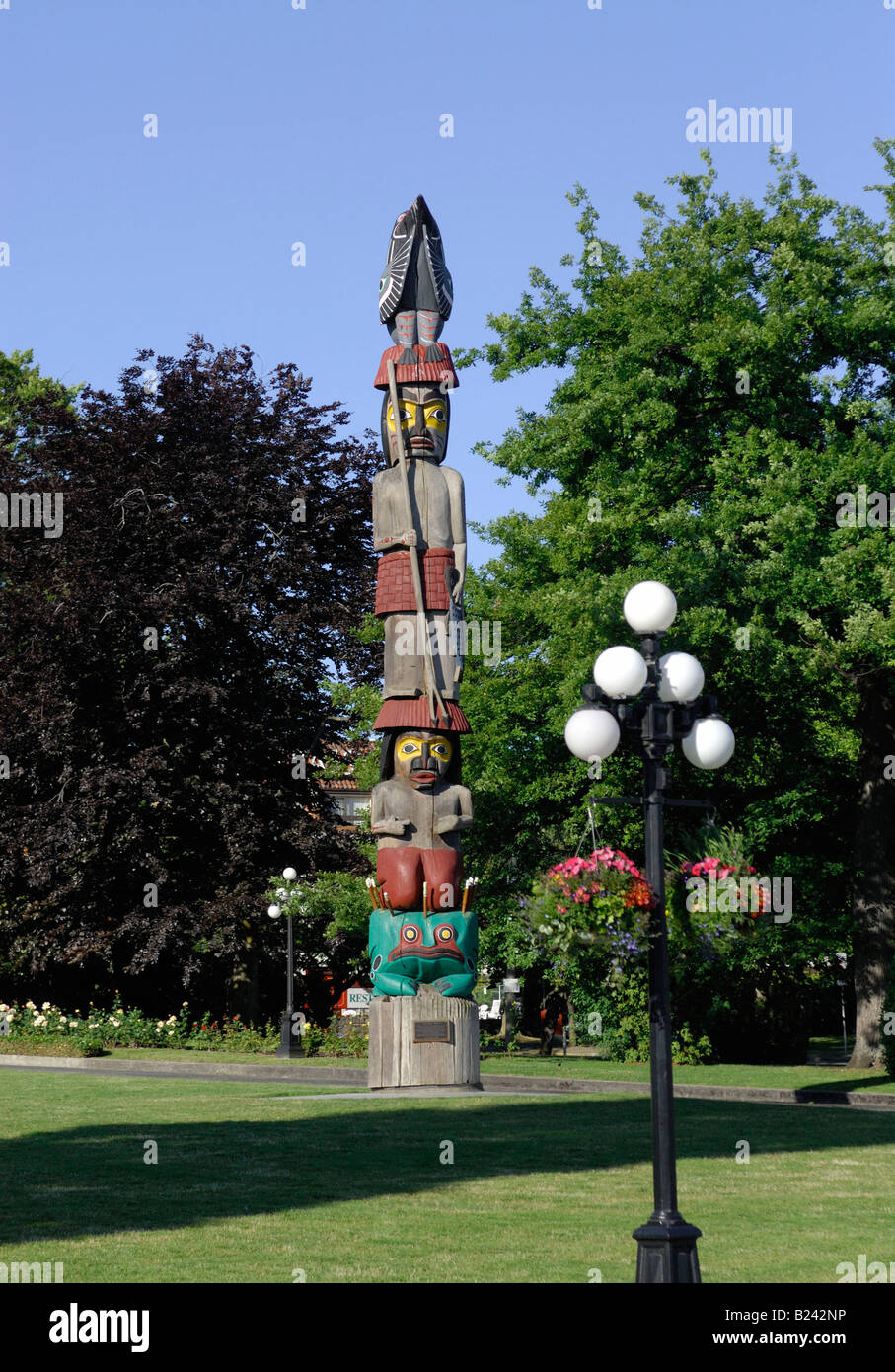 totem pole on grounds of parliament in Victoria, BC, Canada Stock Photo