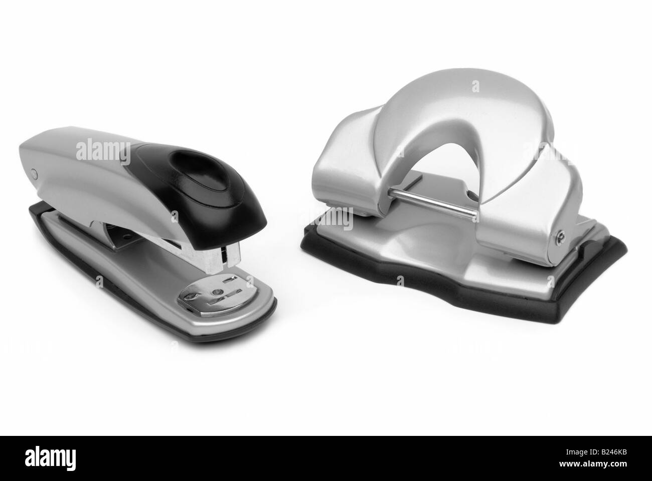 Office stapler and paper punch cut out. Stock Photo