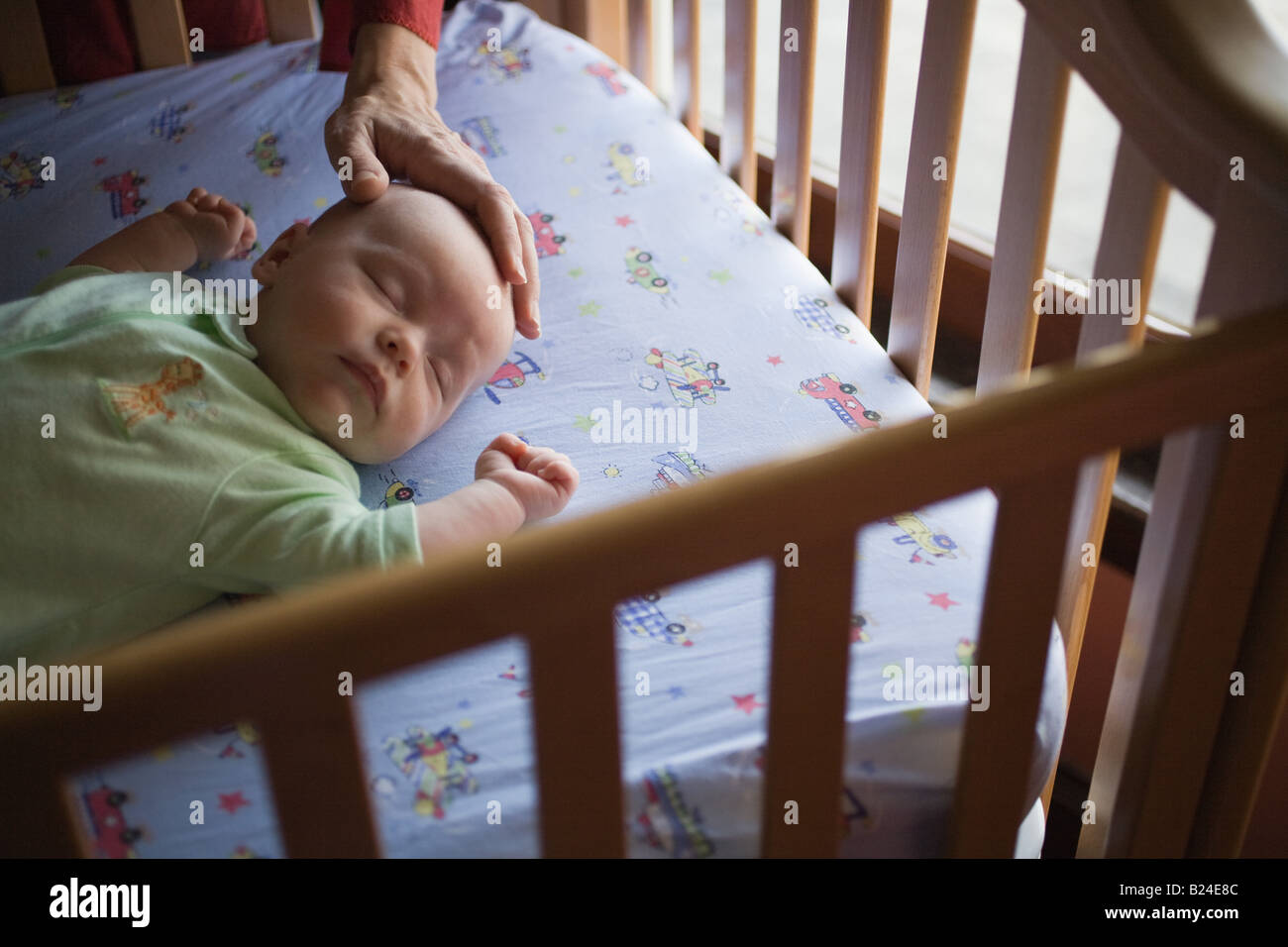 Baby in crib Stock Photo Alamy
