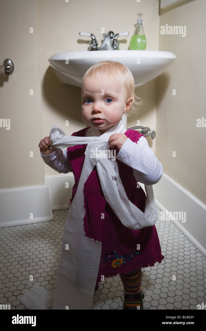 Two little girls using childrens toilets Stock Photo - Alamy