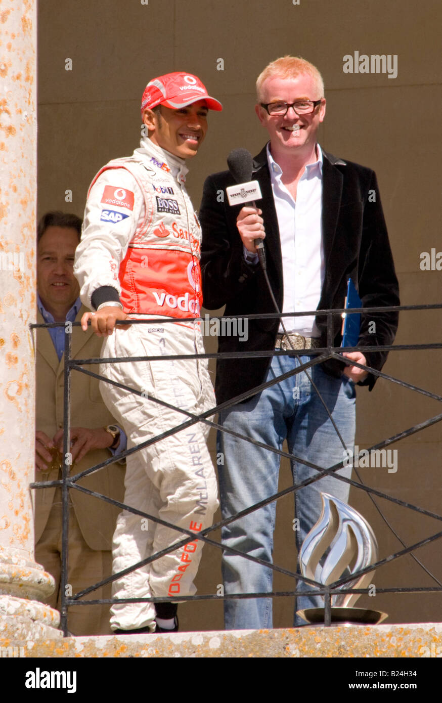 Lewis Hamilton F1 driver for McLaren Mercedes being interviewed by Chris Evans on the balcony of Goodwood House Stock Photo