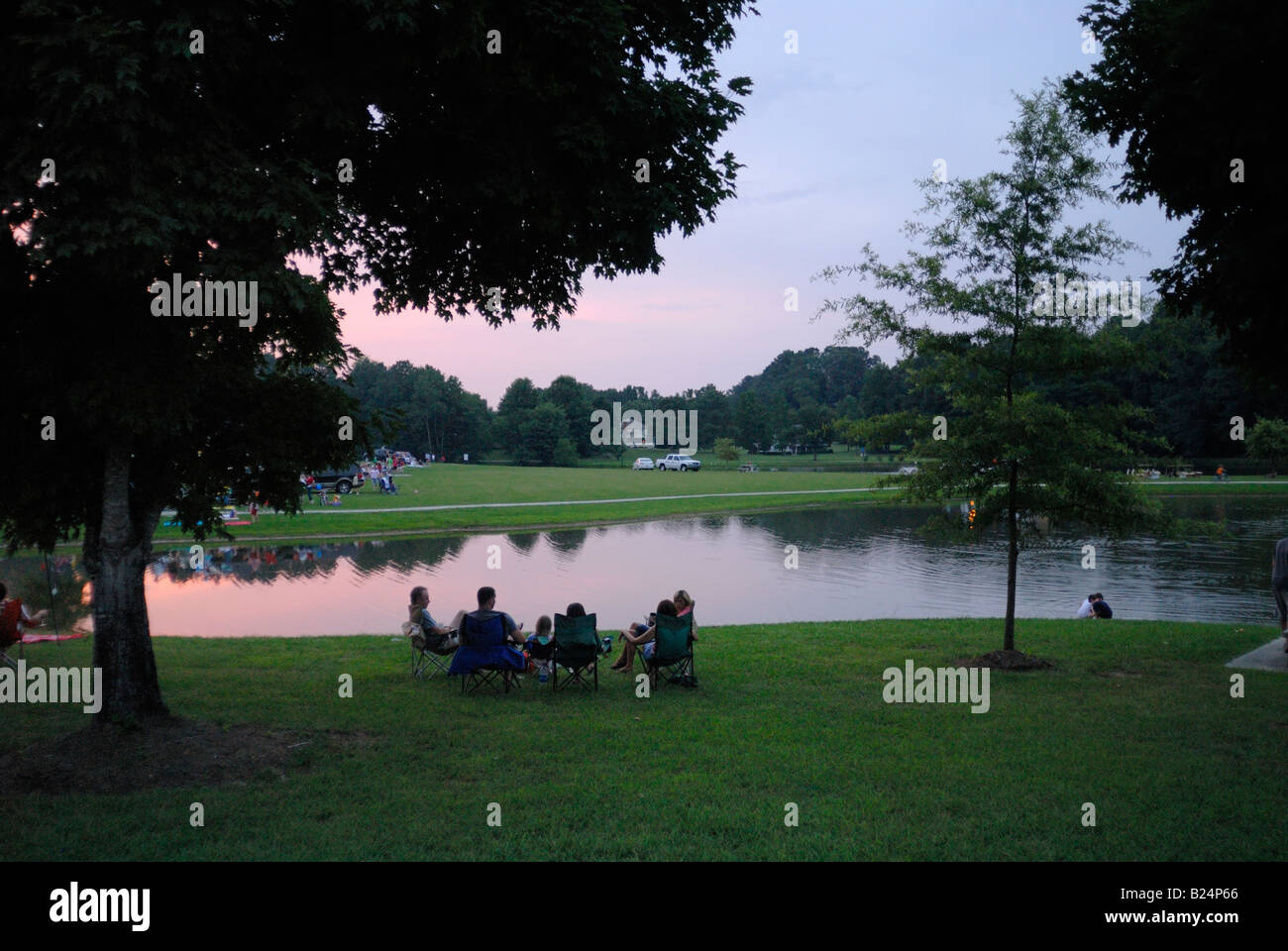 Family enjoying and evening in the park waiting for a fireworks display