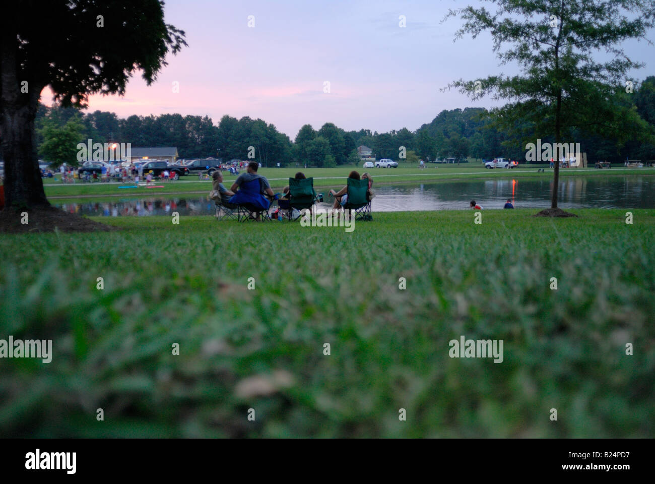 Family enjoying and evening in the park waiting for a fireworks display