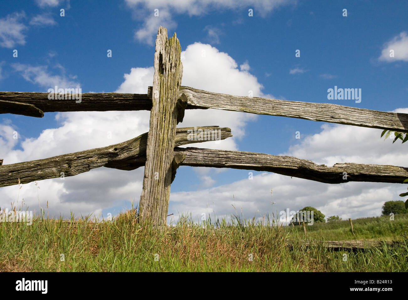 Weatherbeaten wooden fence against a blue sky Stock Photo