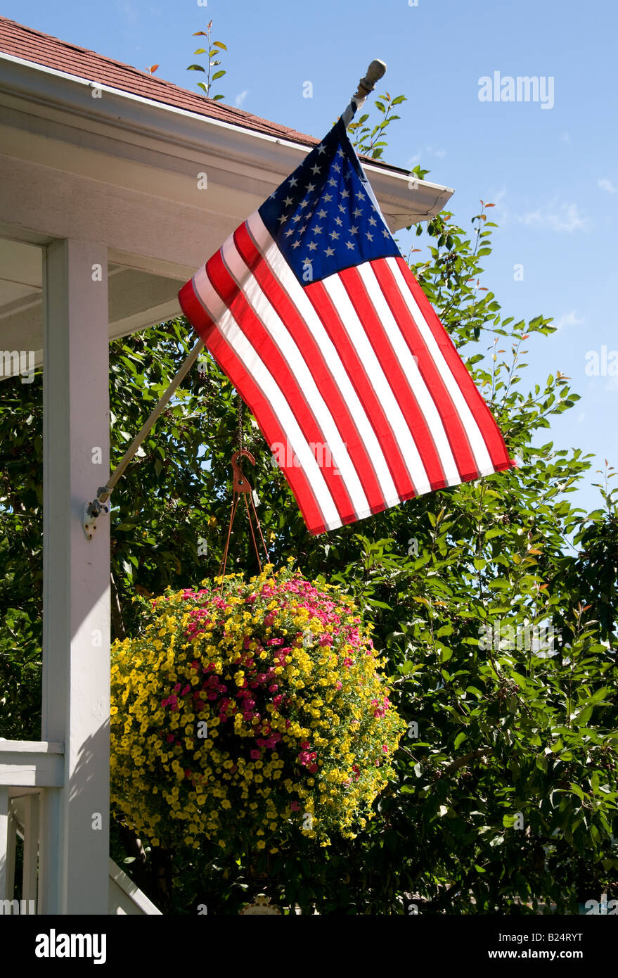 Patriotic home displaying American flag on patio Stock Photo - Alamy