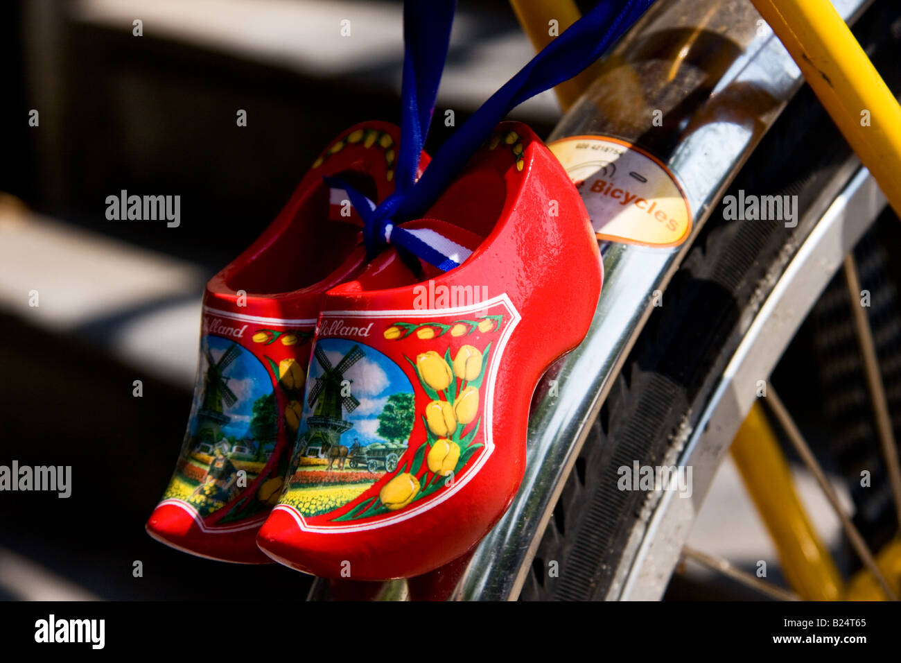 Minature souvenir clogs attached to a bicycle in Amsterdam Holland Stock Photo