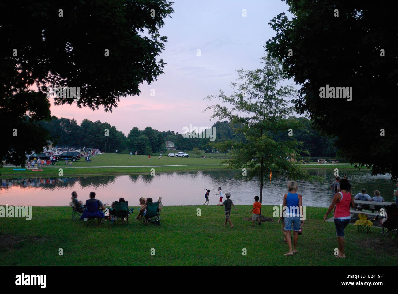 Family enjoying and evening in the park waiting for a fireworks display