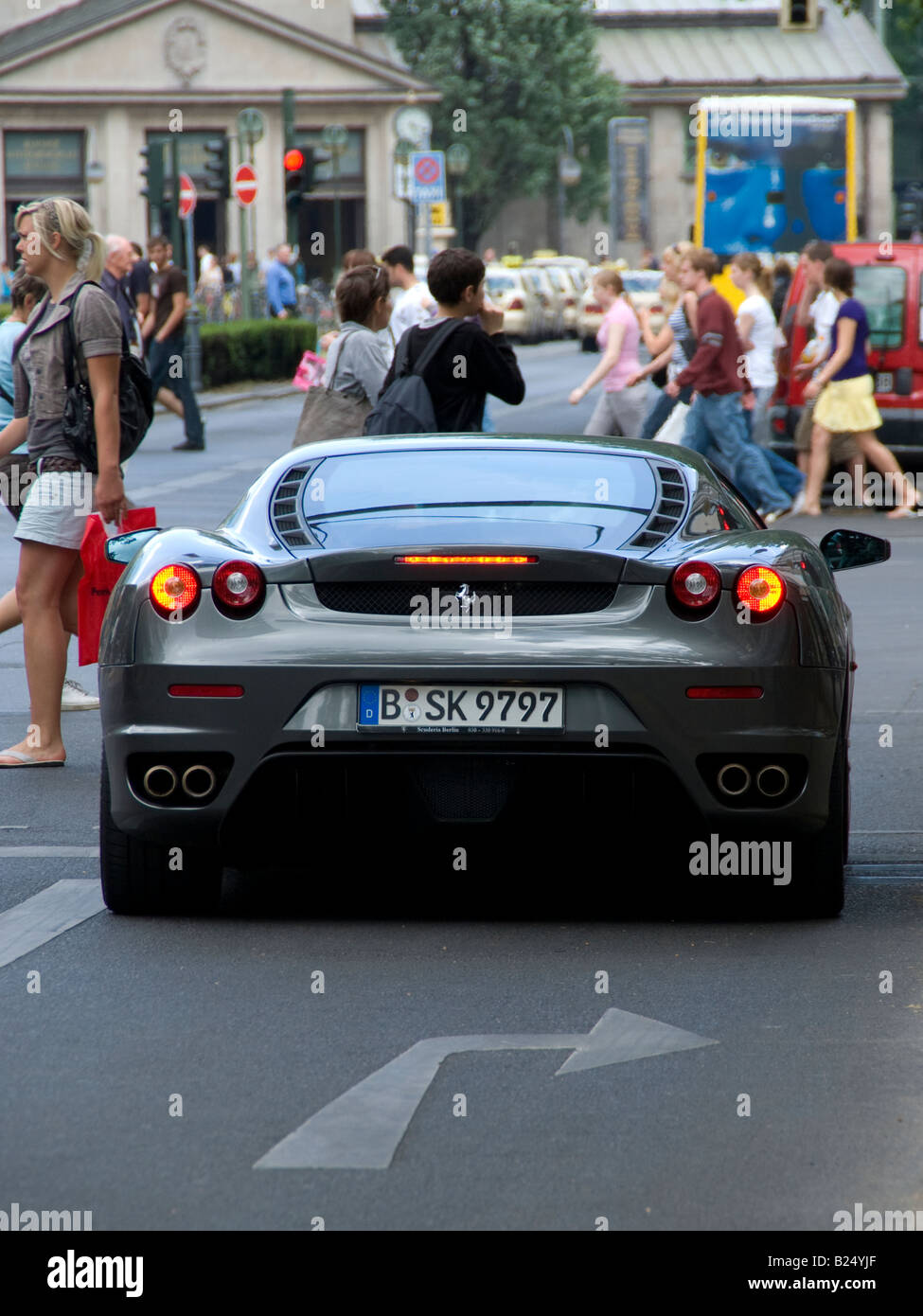 Ferrari waiting on a pedestrian crosswalk in Berlin Stock Photo