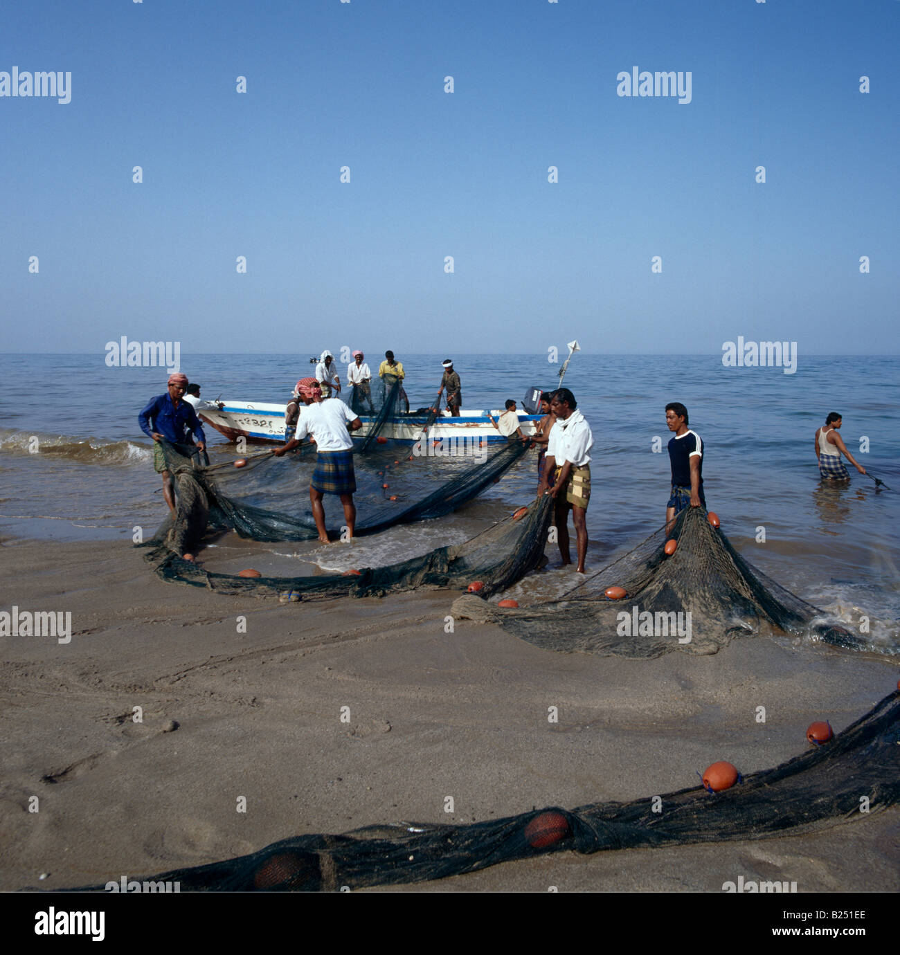 Sharjah UAE Fishermen With Fishing Nets Khor Fakkan Stock Photo Alamy