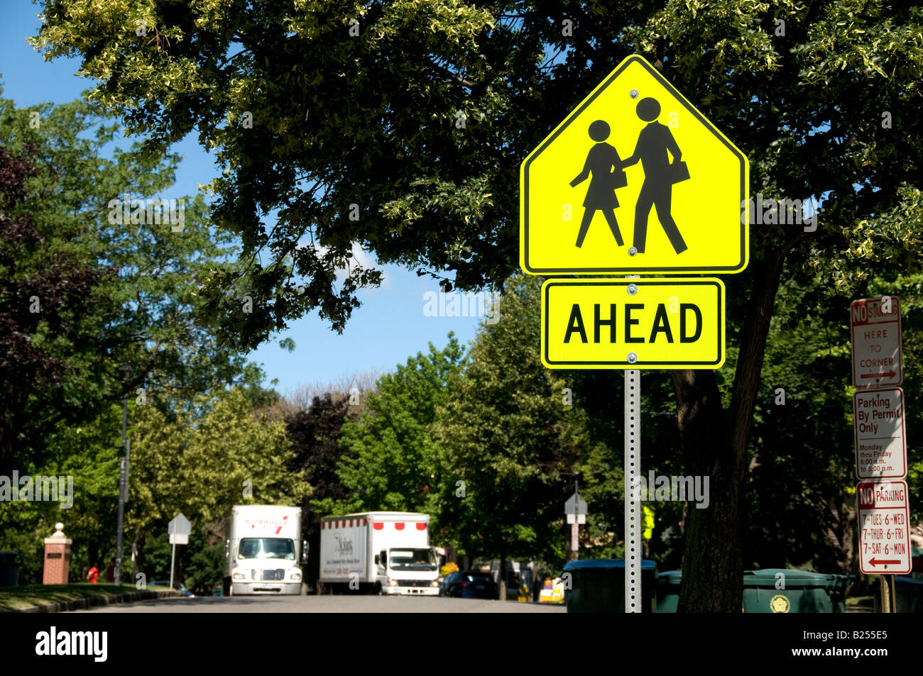 Pedestrian crossing sign near a school on a Rochester, NY. USA Street