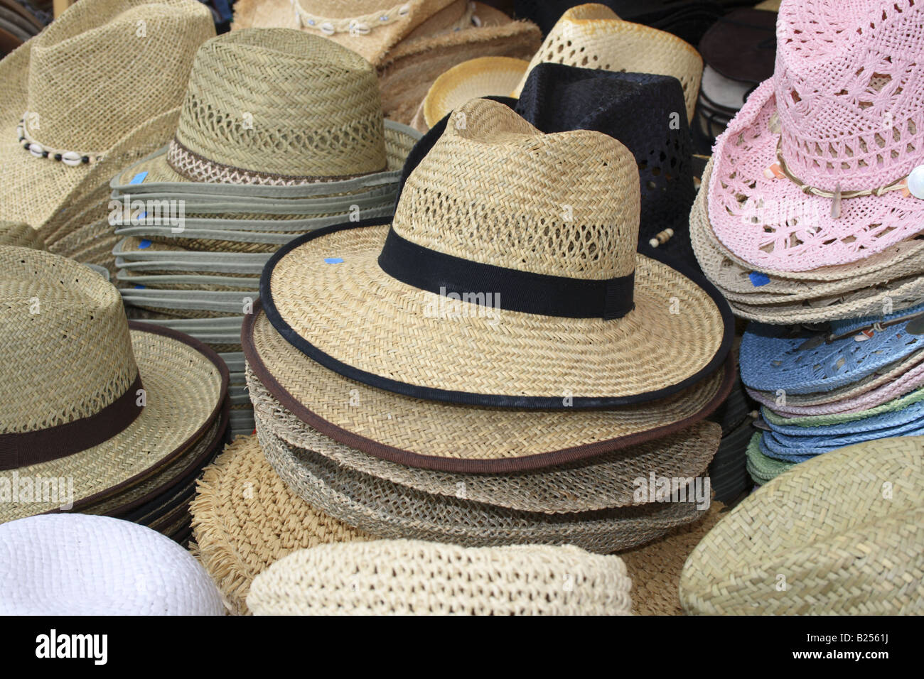 piled straw hats on outdoor market stall at Tollwood summer music festival Munich, Bavaria, Germany. Photo by Willy Matheisl Stock Photo