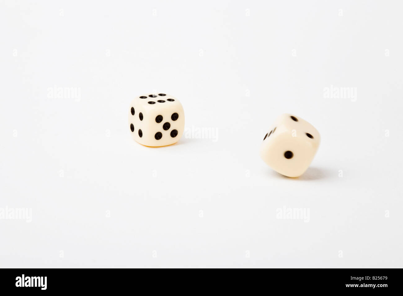 Rolling dice on white background Stock Photo Alamy