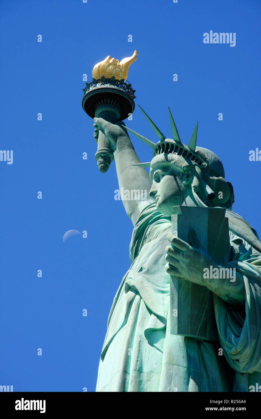 Statue of Liberty with the moon in the background - New York City, USA Stock Photo