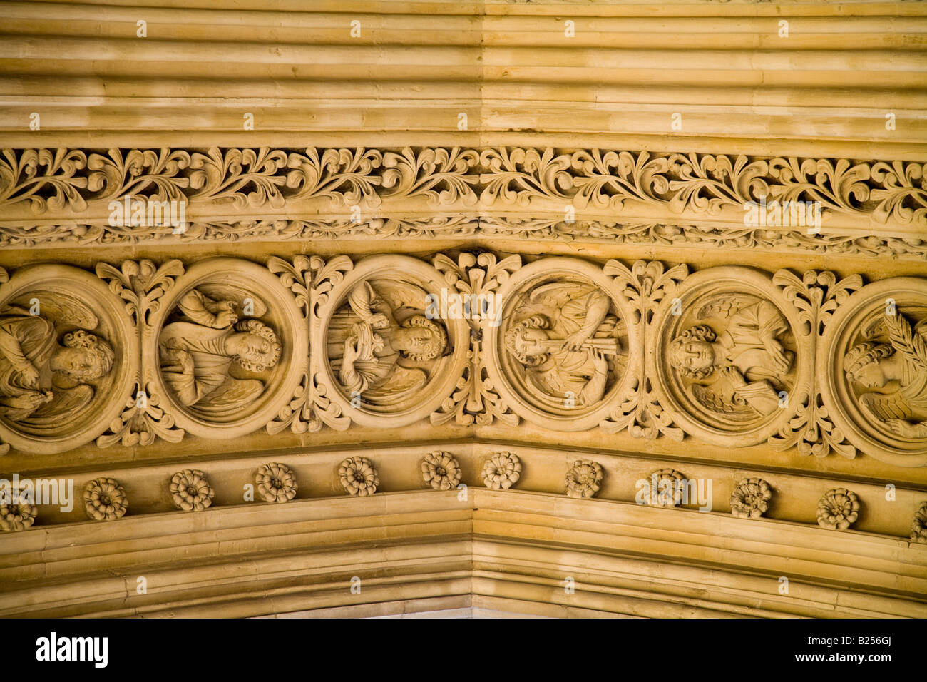 Detail at the top of the pointed arch of the north transept door Westminster Abbey London England Stock Photo