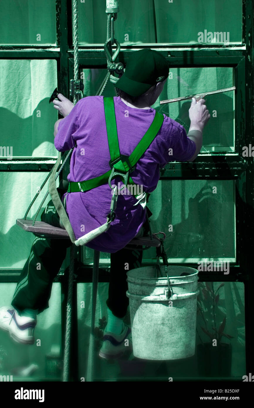 hangin from a ropes washing windows Stock Photo Alamy