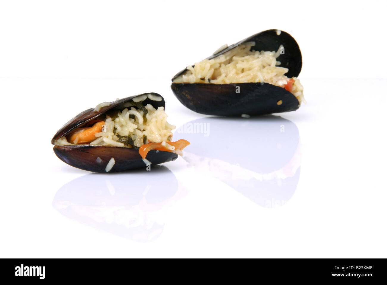 gourmet two mussels cooked with rice isolated on white background with ...