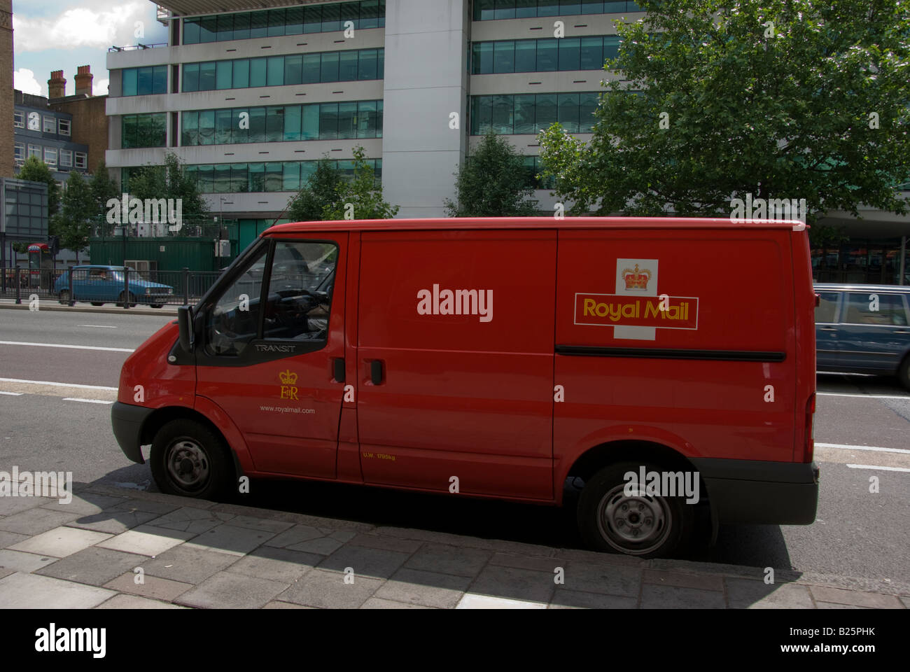 Royal Mail delivery van standing at the side of a road in London Stock Photo