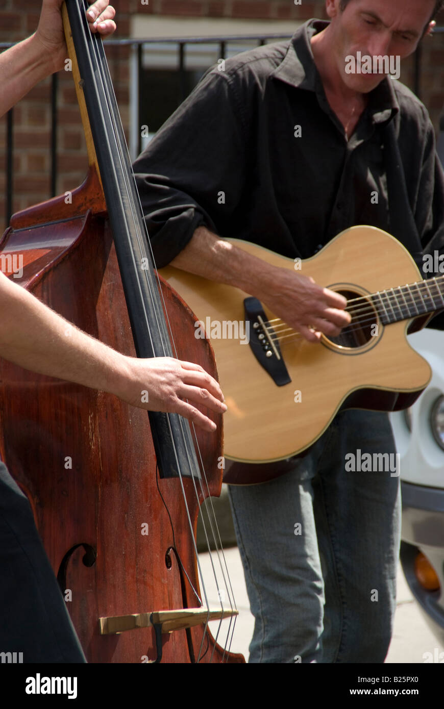 Two street musicians playing guitar and contrabass on Portobello Road Stock Photo