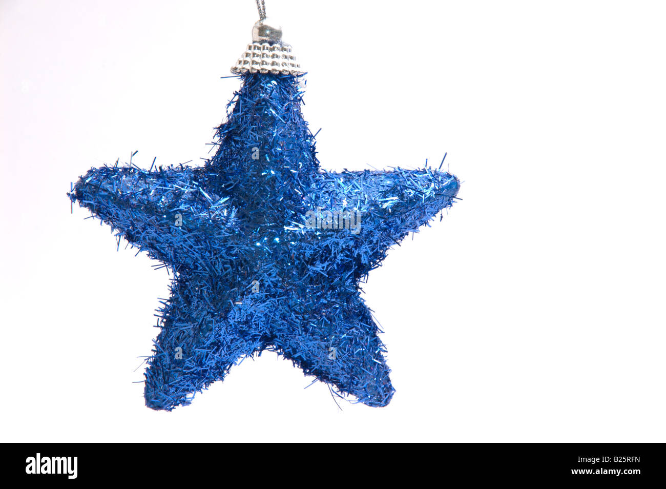 Festive blue tinsel sparkly star tree decoration cut-out 1/3 Stock Photo