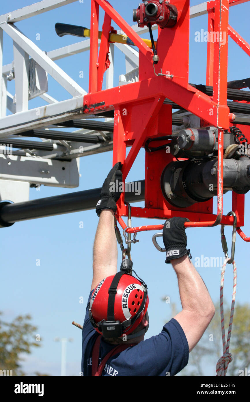 An aerial rescue using a ladder truck with the firefighter hooking up