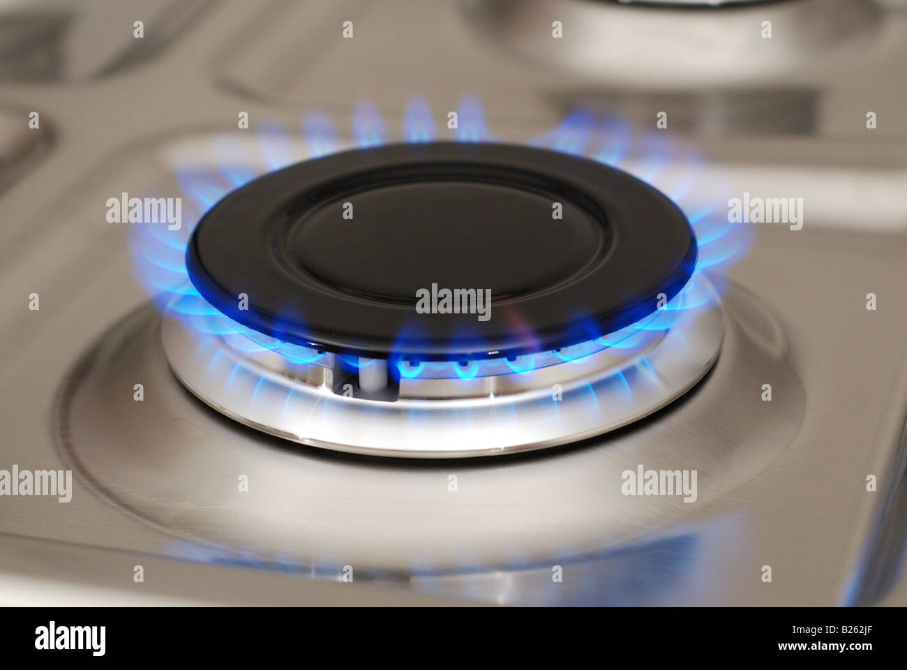 Gas burner with flame in the inox background Stock Photo Alamy