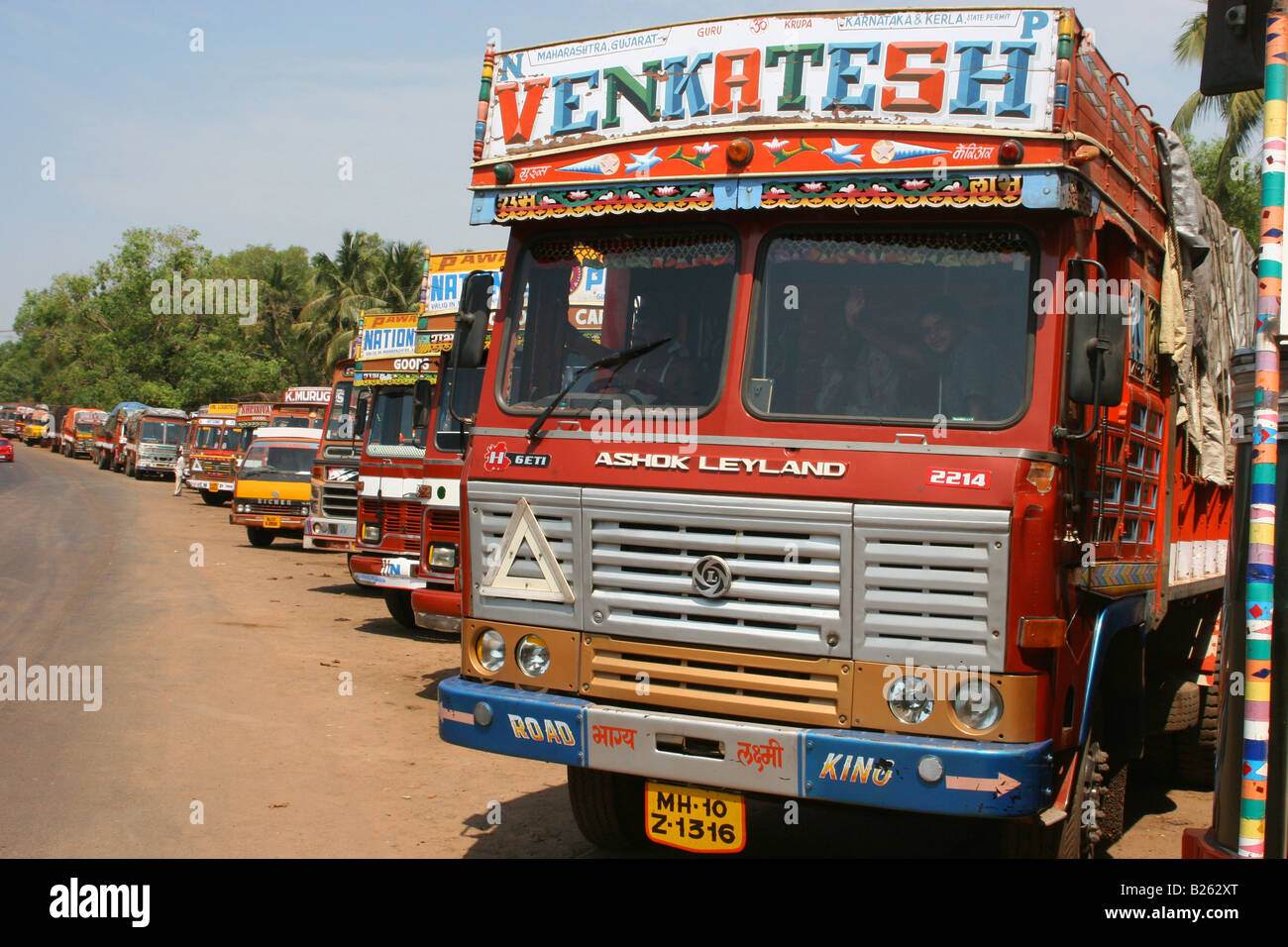 Trucks lined up on the roadside near Kasaragod Kerala India Stock Photo