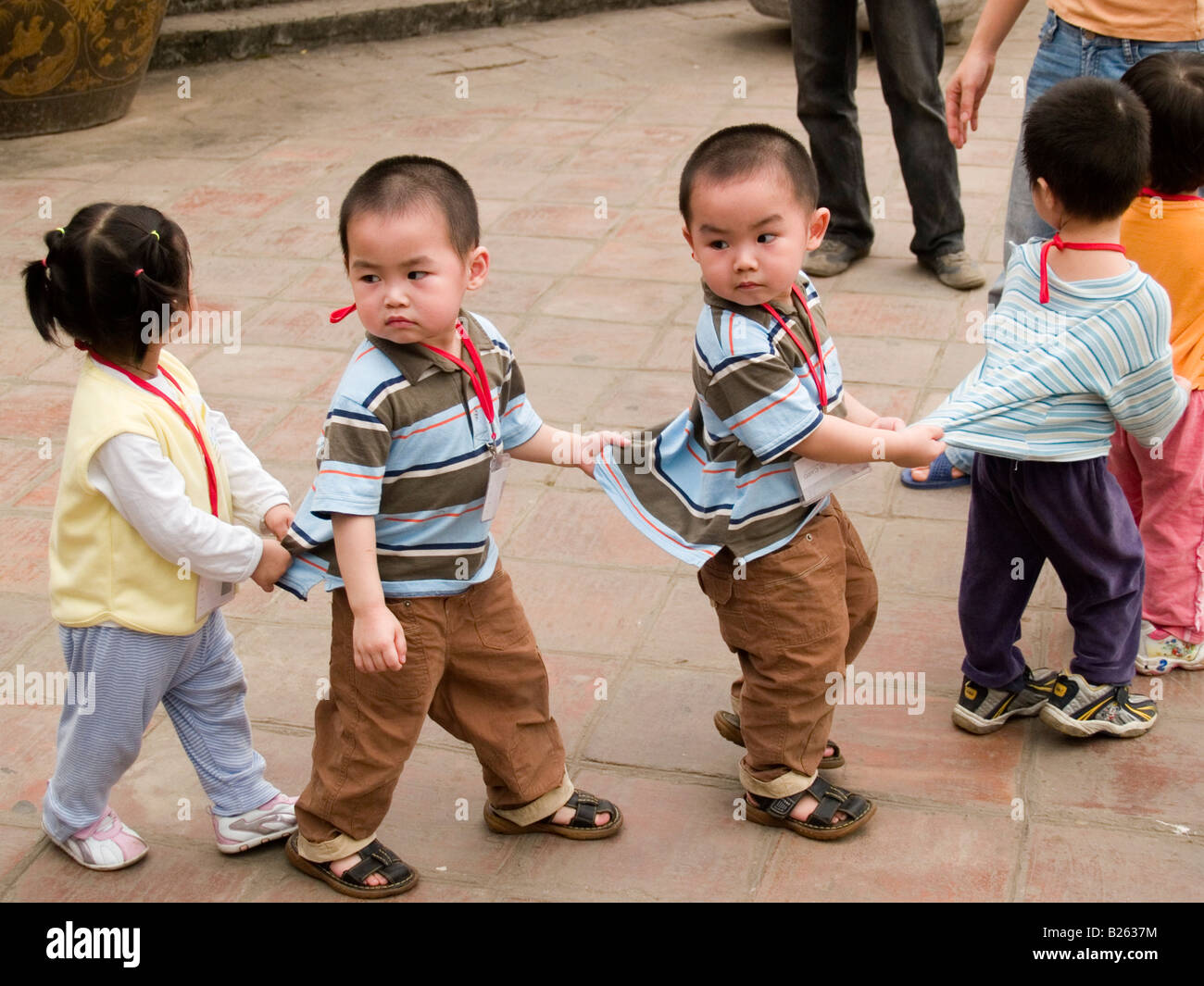 funny matching twins Hanoi Vietnam Stock Photo - Alamy