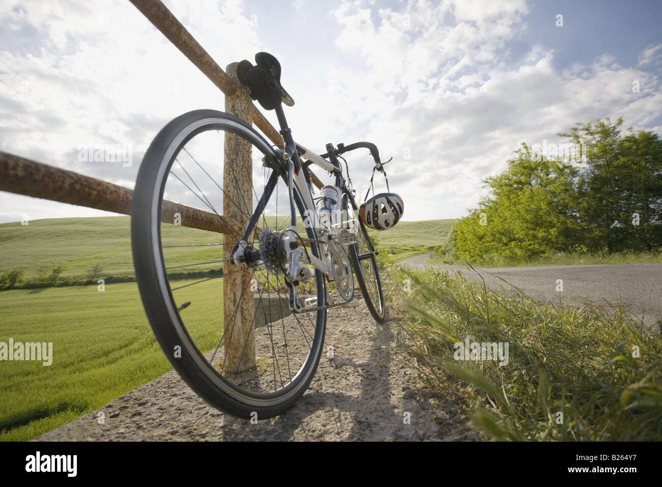 Racer bike parked on roadside by the railing Stock Photo