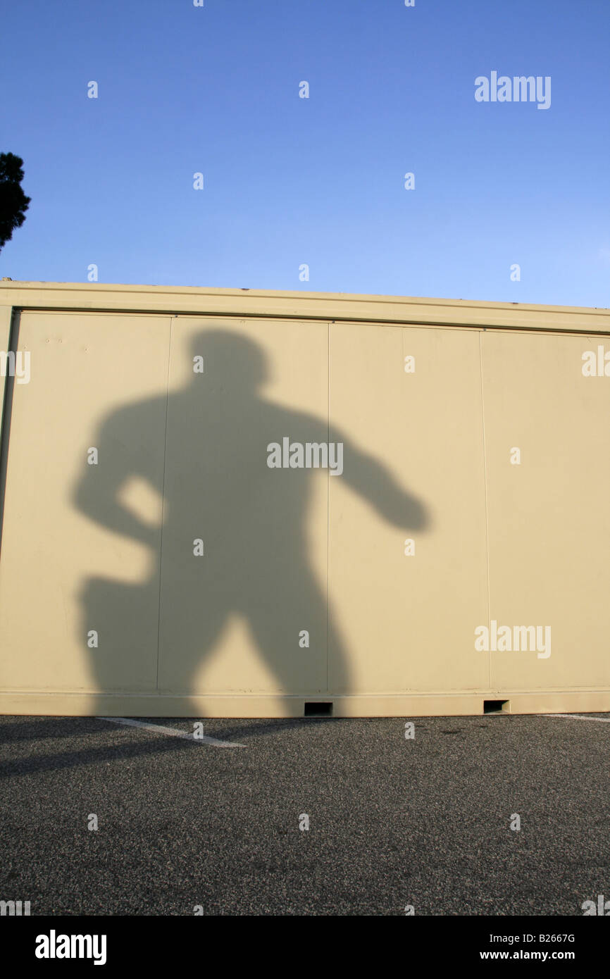 one strong man statue's shadow on cabin Stock Photo Alamy