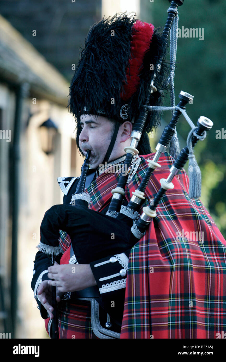 Scottish piper, Man playing the bagpipes in traditional dress, Southern Highlands, Scotland, Great Britain, Europe Stock Photo