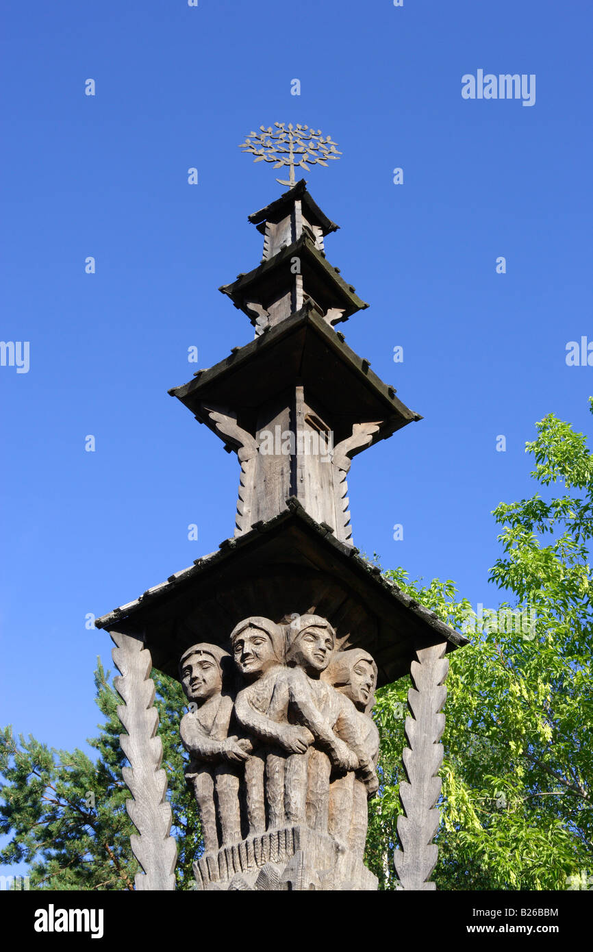 Carved wooden pole decorates farmhouses in the district of Druskininkai, Lithuania Stock Photo