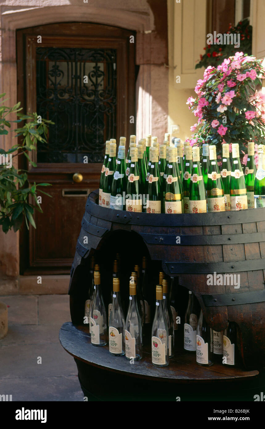 Wine bottles in a barrel, Wine growing town of Ribeauville, Alsace, Haut-Rhin, France Stock Photo