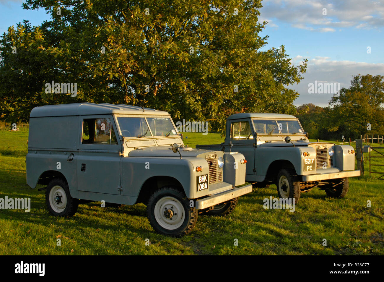 AppleMark A matching couple of two historic 1963 Landrover Series 2a's on a farm in Dunsfold, UK 2004. Stock Photo