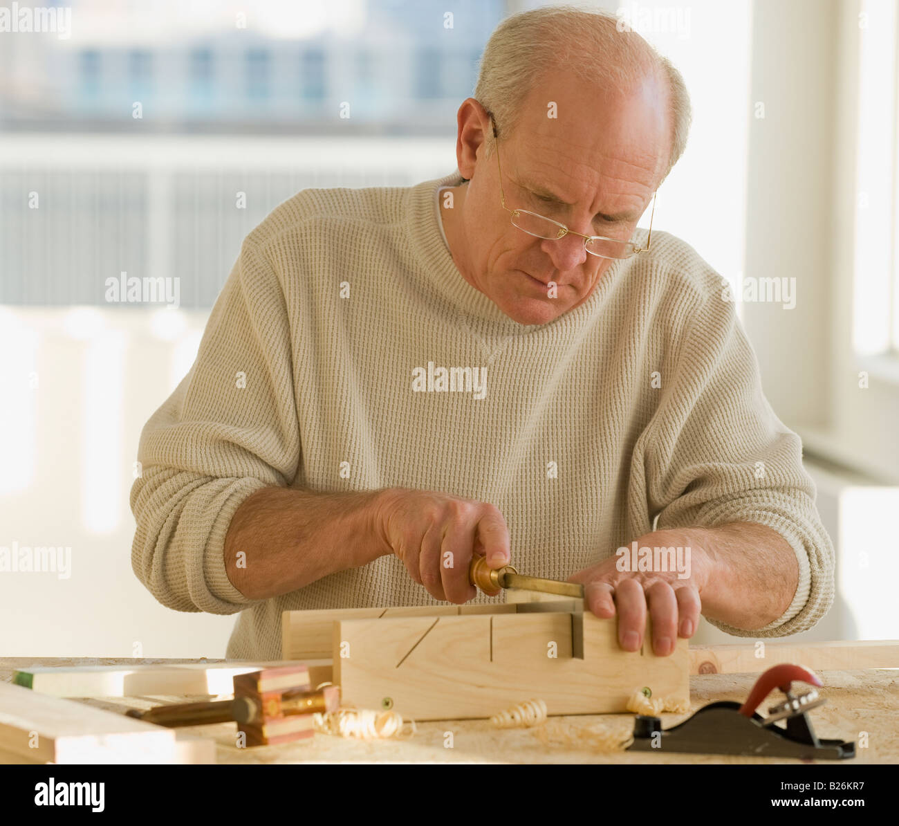 Senior man woodworking Stock Photo Alamy
