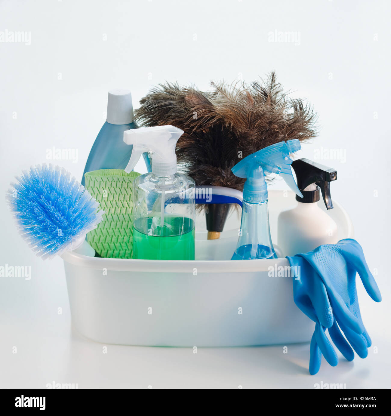 Bin of cleaning products and rubber gloves Stock Photo