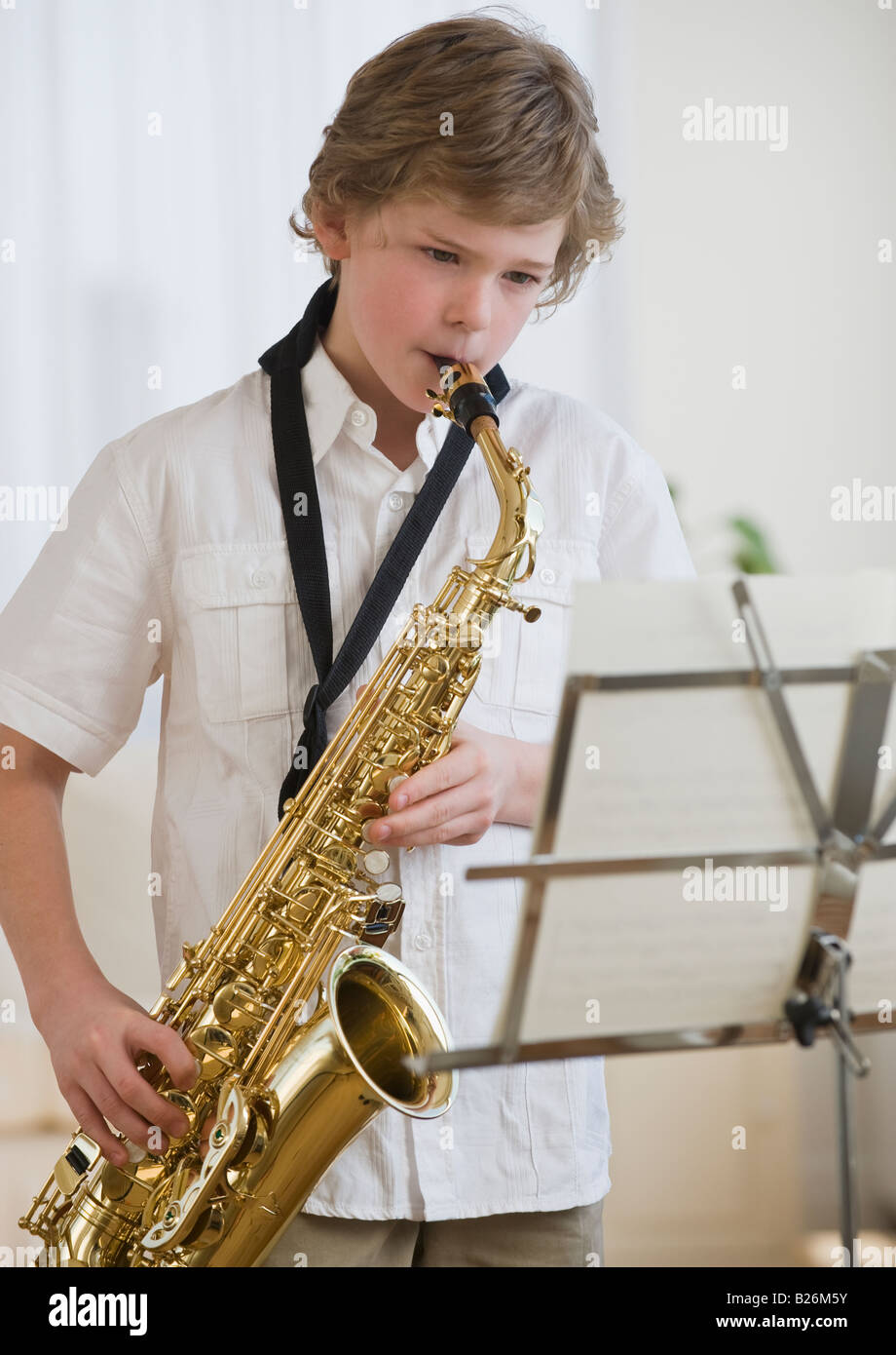 Boy playing saxophone Stock Photo