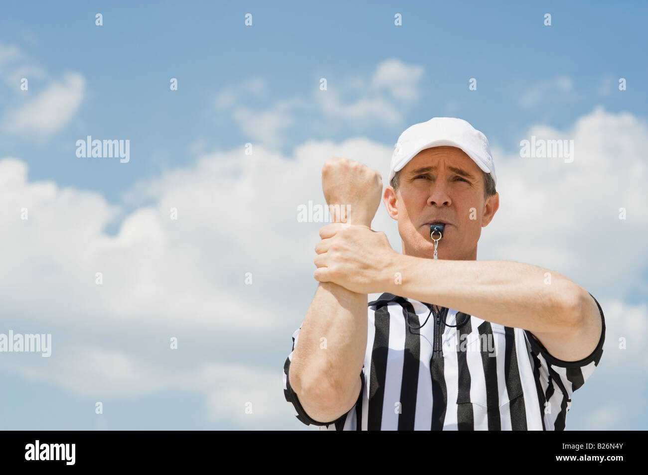 Male football referee making holding call Stock Photo Alamy
