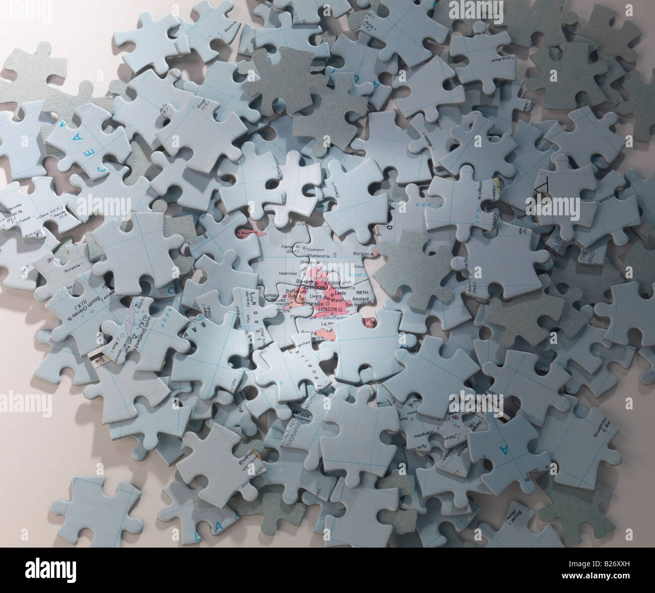 Jigsaw map of Britain surrounded by sea pieces Stock Photo