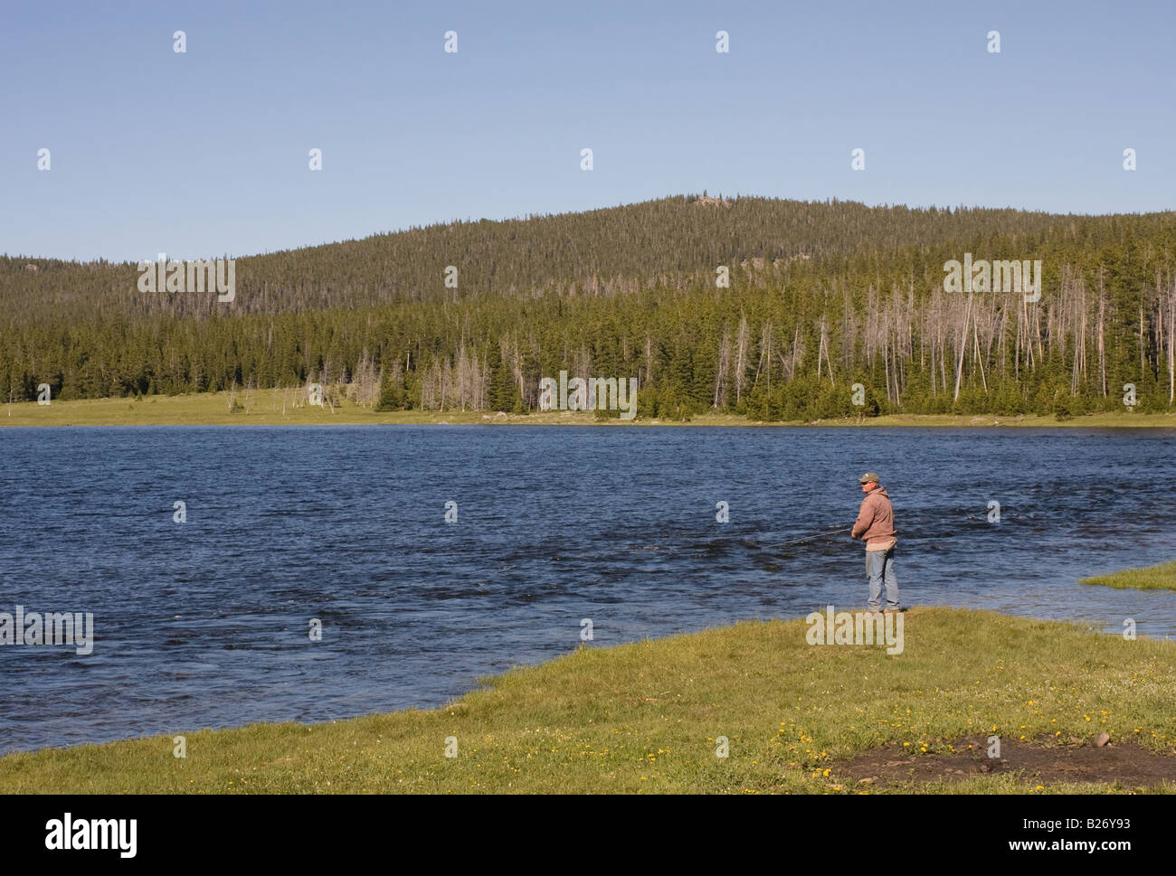 Man fishing at Willow Park Reservoir in the Big Horn Mountains of