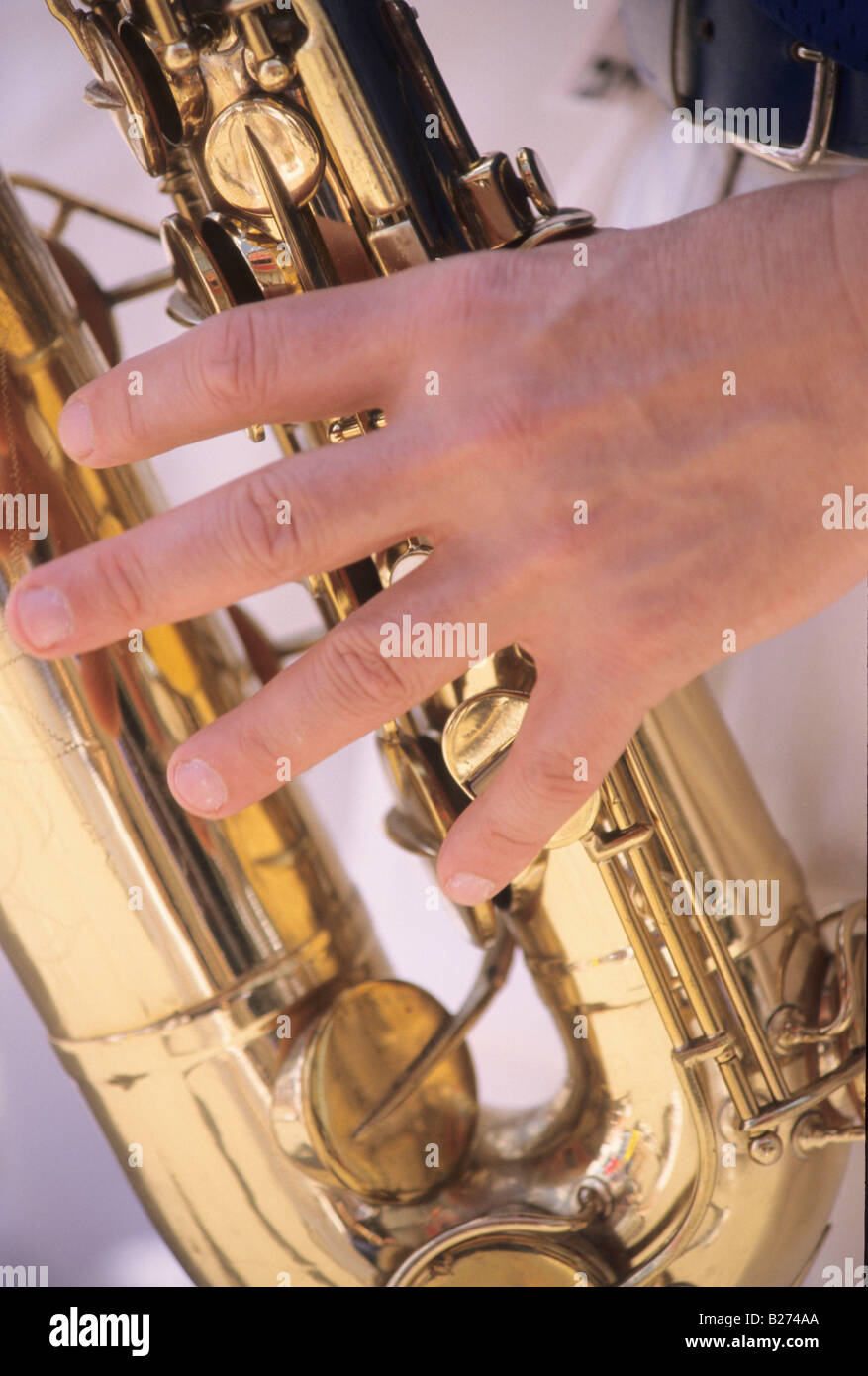 HAND AND SAXOPHONE Stock Photo