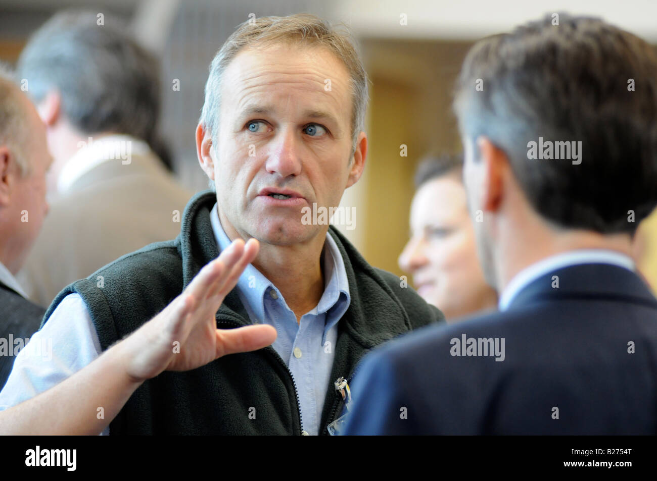 Royalty free photograph of a British business men in meeting talking