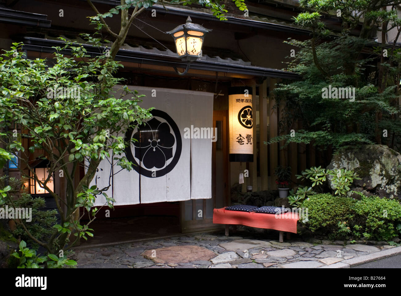 Large noren curtain hanging at the entrance to a traditional style restaurant in the Kibune area of the hills around Kyoto city Stock Photo