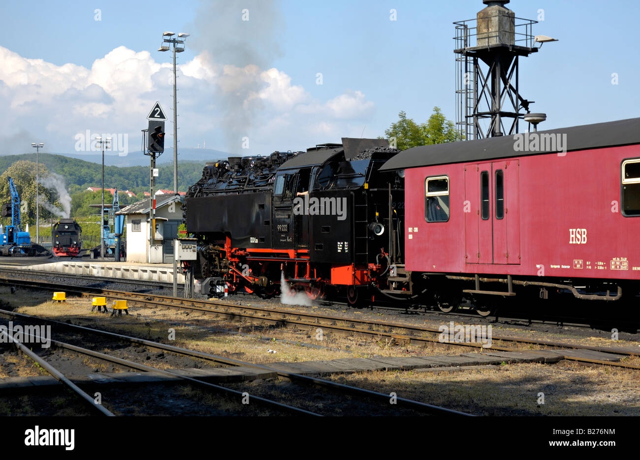 Steam locomotive departing from Wernigerode with a train to the Brocken Mountain (in background), Harz, Germany. Stock Photo