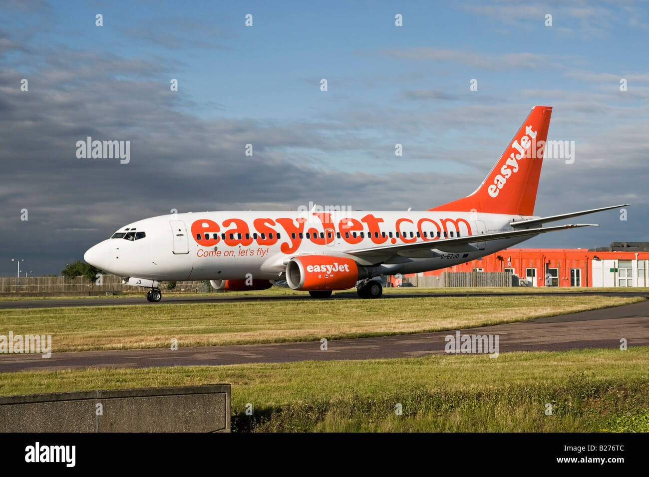 A Boeing B737 series 700 of the UK s budget airline EasyJet taxy s in at Luton Airport Stock Photo