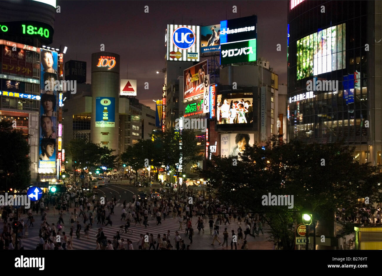 Upscale shopping district Shibuya in Tokyo at the street crossing in front of the main train station at night Stock Photo