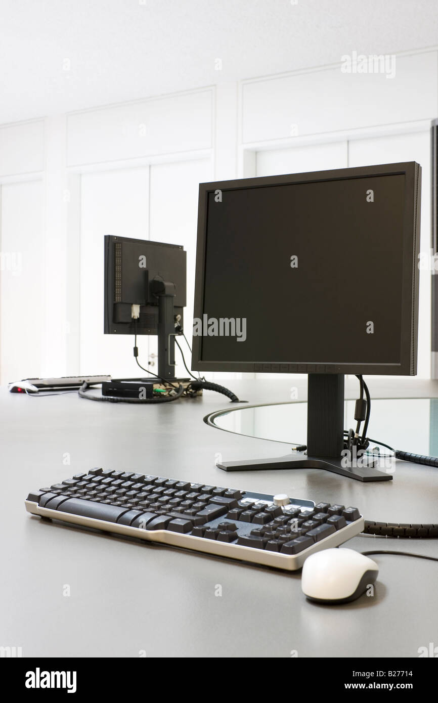 Two computers in an office or a seminar room Stock Photo - Alamy