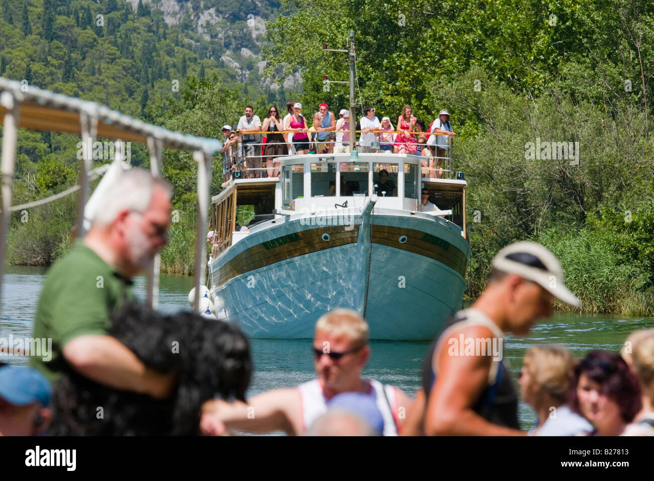 Krka waterfalls, Skradinski buk, lower falls area, Croatia, Europe, unloading visitors from wooden boats Stock Photo
